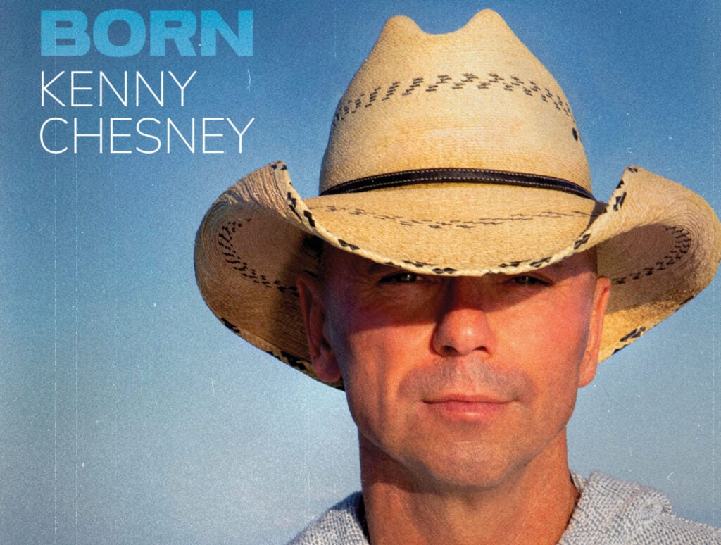 Kenny Chesney Born album cover his face in a straw cowboy hat 