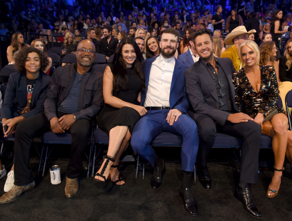 Sam Hunt Is Working To Heal - Sam and his wife Hannah with Darius Rucker and Luke Bryan and his wife sitting at a Nashville award show. 